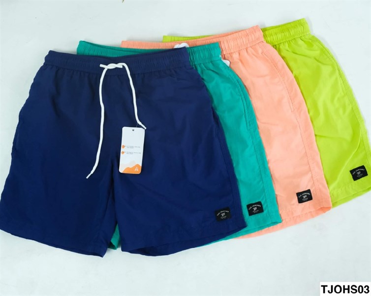 Four drawstring shorts fanned out in cobalt blue, mint, peach-orange and neon green on a white surface